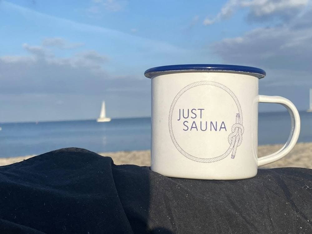 The Just Sauna enamel mug by the sea